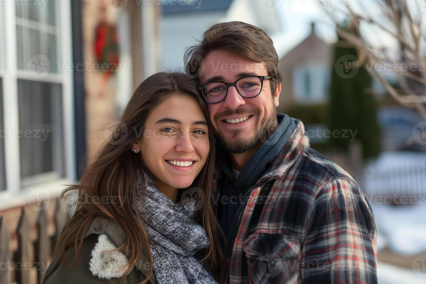 Smiling Couple Embracing Outdoors During Winter Season in Residential Neighborhood photo