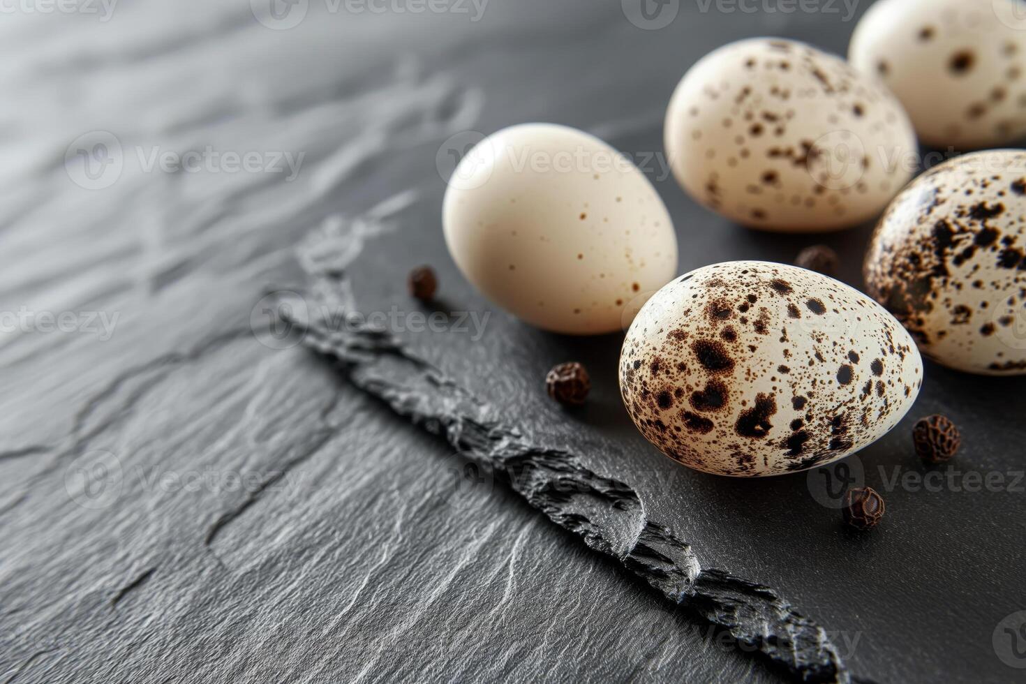 Fresh Quail Eggs on Slate Background with Natural Light and Textures photo