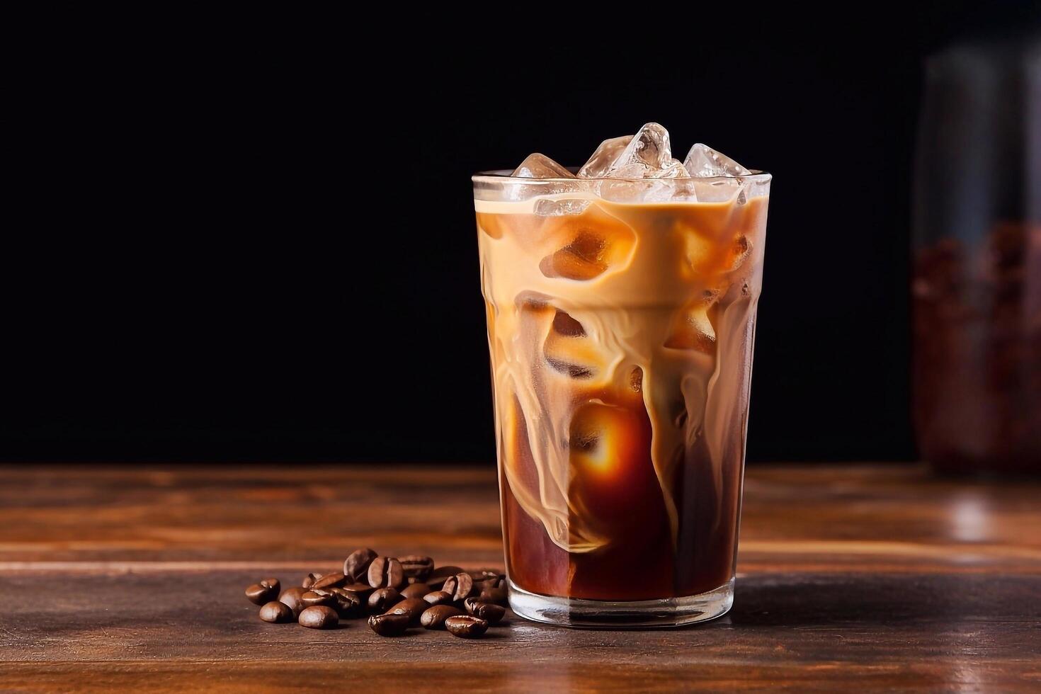 Iced coffee in a glass on a wooden table photo