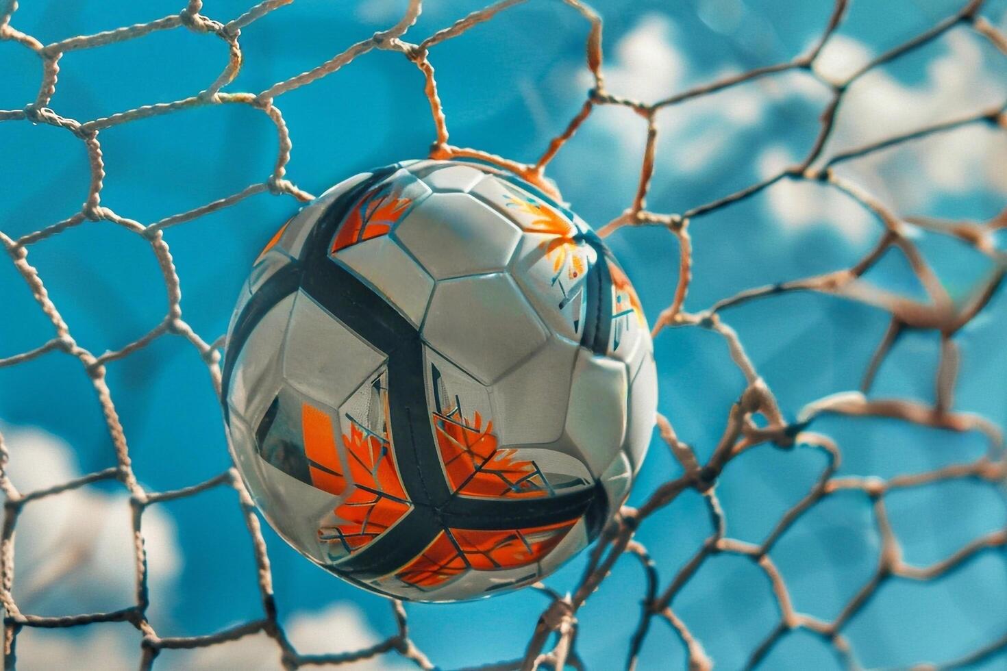 Soccer ball in football goal net. photo