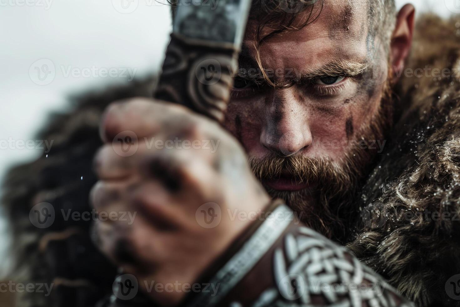 Intense Nordic Warrior Holding Sword in Battling Pose photo