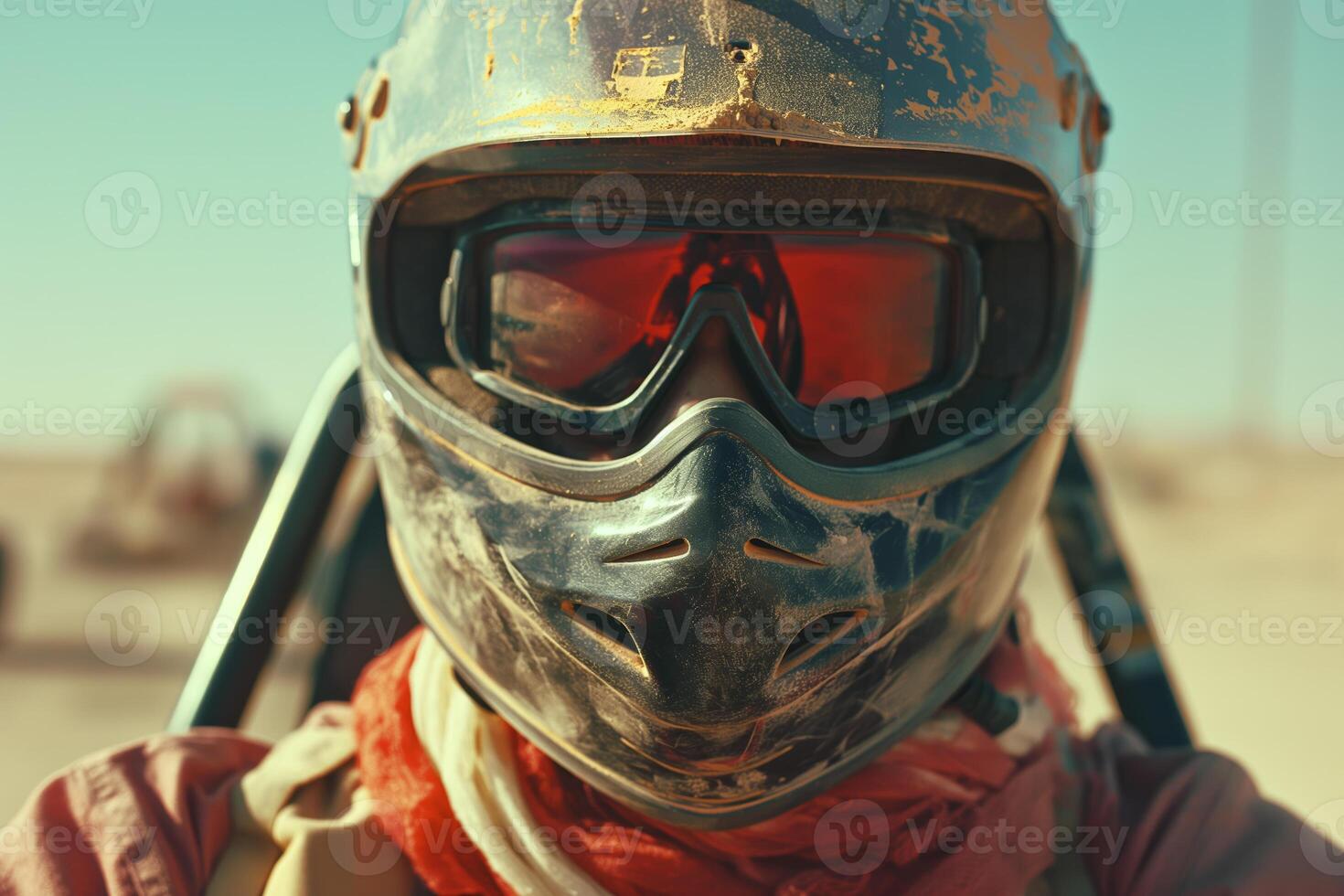 Adventure Enthusiast Wearing Helmet and Reflective Goggles in Desert Environment photo