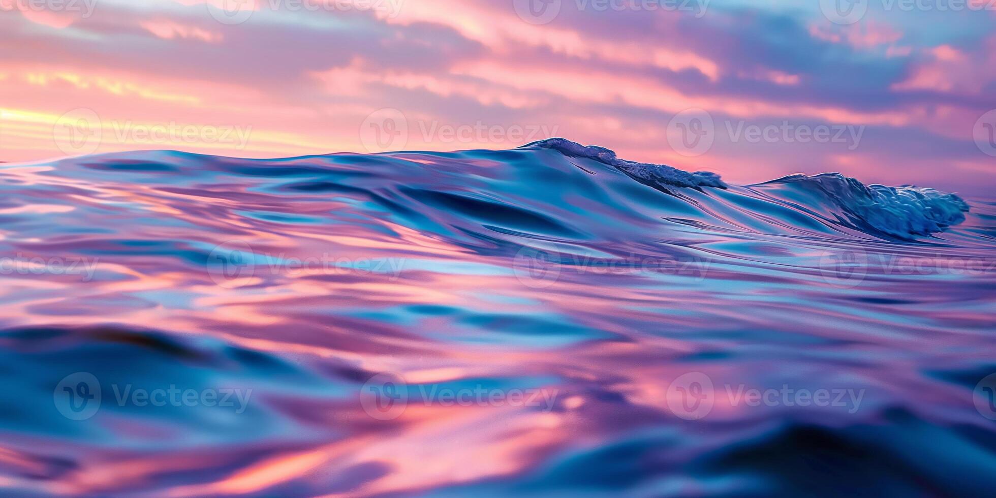 Vibrant Sunset Over Ocean Waves With Pink and Purple Sky photo