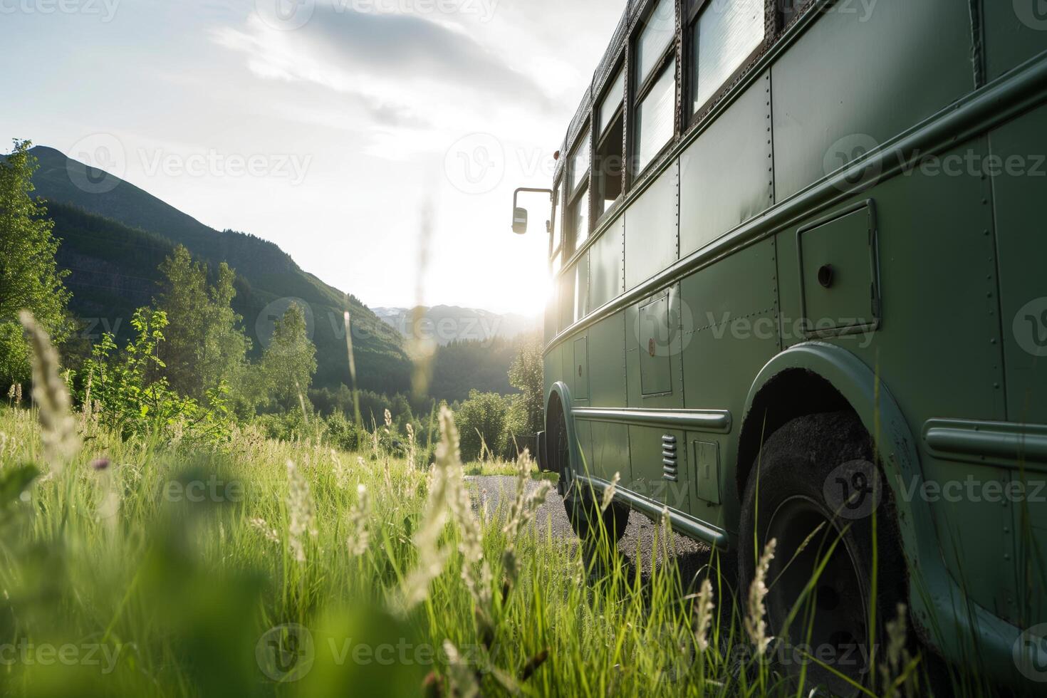 Vintage Green Bus in Scenic Countryside during Sunset photo