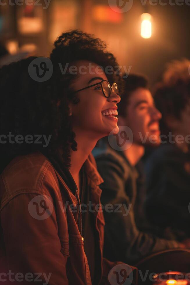 Laughter and Joy Friends Enjoying a Night Out in a Warmly Lit Cafe photo