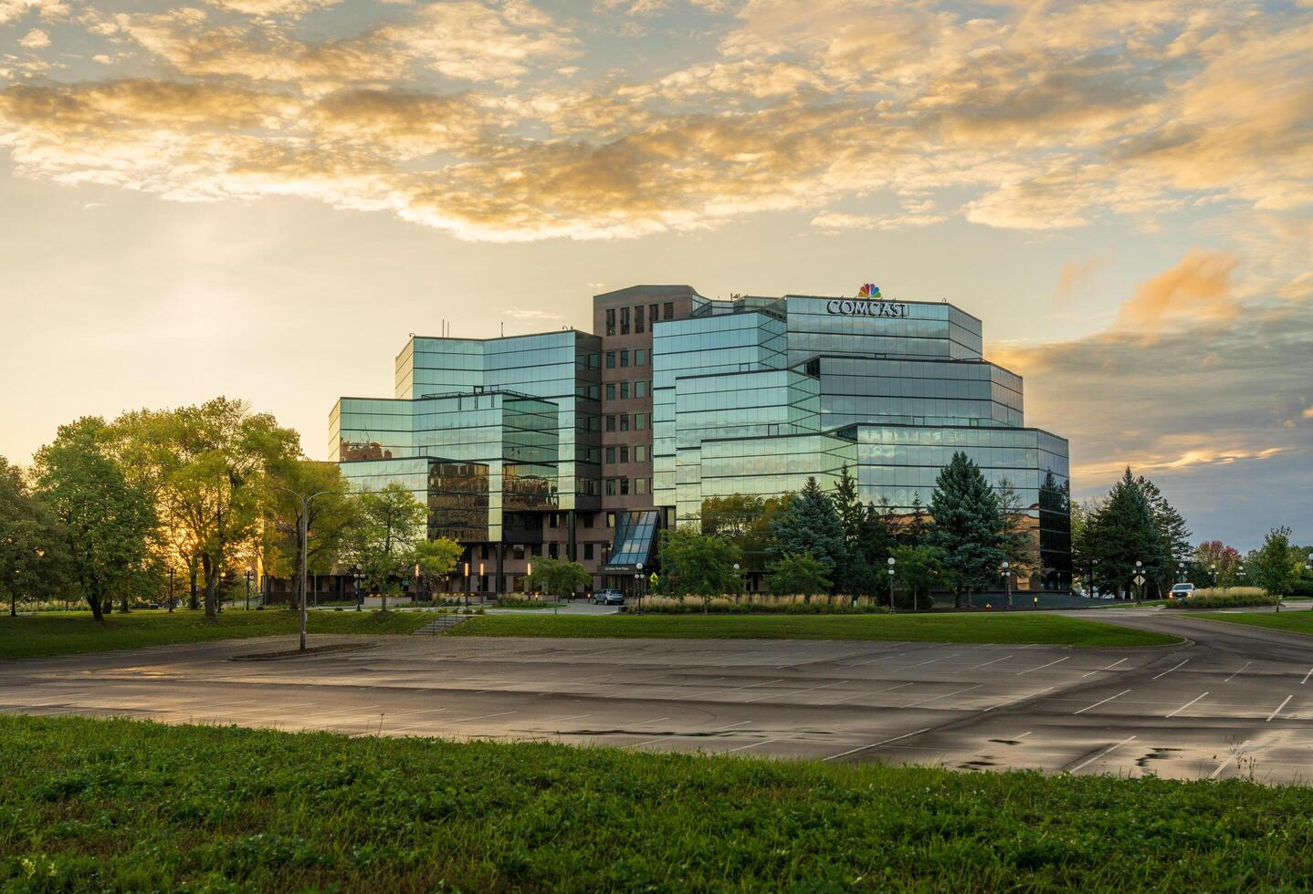 St Paul, MN - 14 October 2023. Sunrise behind Comcast offices on River Park Plaza in Minnesota photo