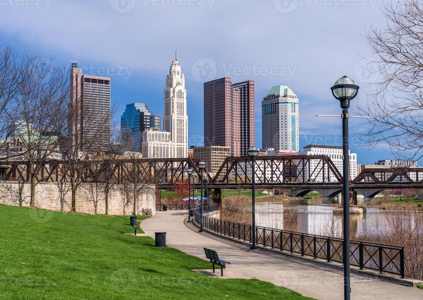 Columbus Ohio waterfront view of the downtown financial district from the River Scioto through a railroad truss bridge photo