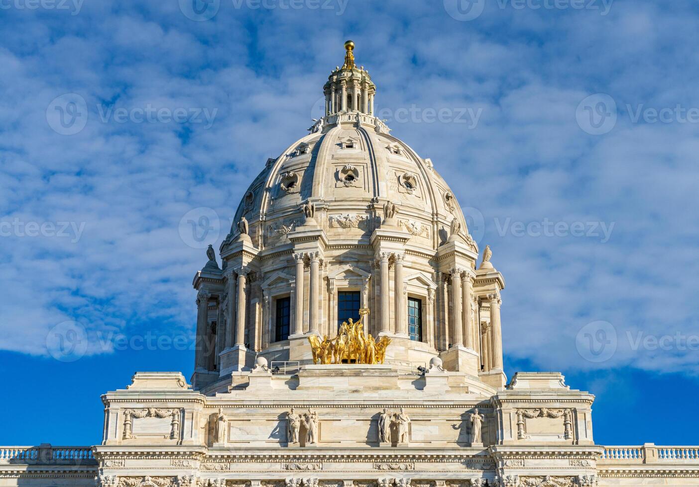 Front view of the dome and gold Quadriga statue of the Capitol building in the state of Minnesota in Saint Paul, MN photo