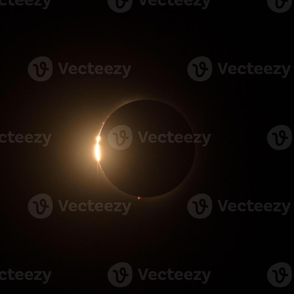 HD images of the solar eclipse in 2024 with the moon just about to finally cover the sun for totality. photo