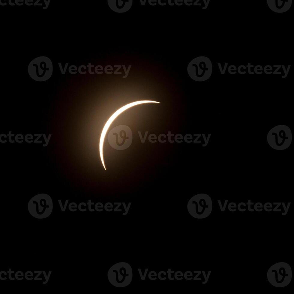 Final stage of the solar eclipse in April 2024 with the moon starting to cover the sun photo