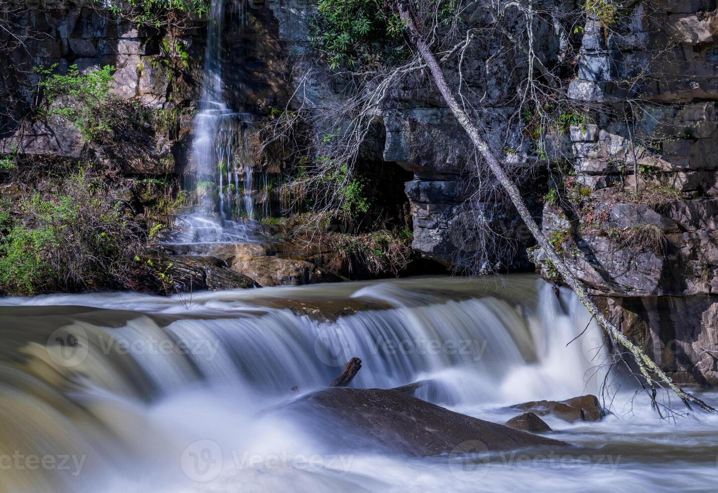 Small waterfall cascade on rocks by Valley Falls State Park near Fairmont in West Virginia on a colorful and bright spring day photo