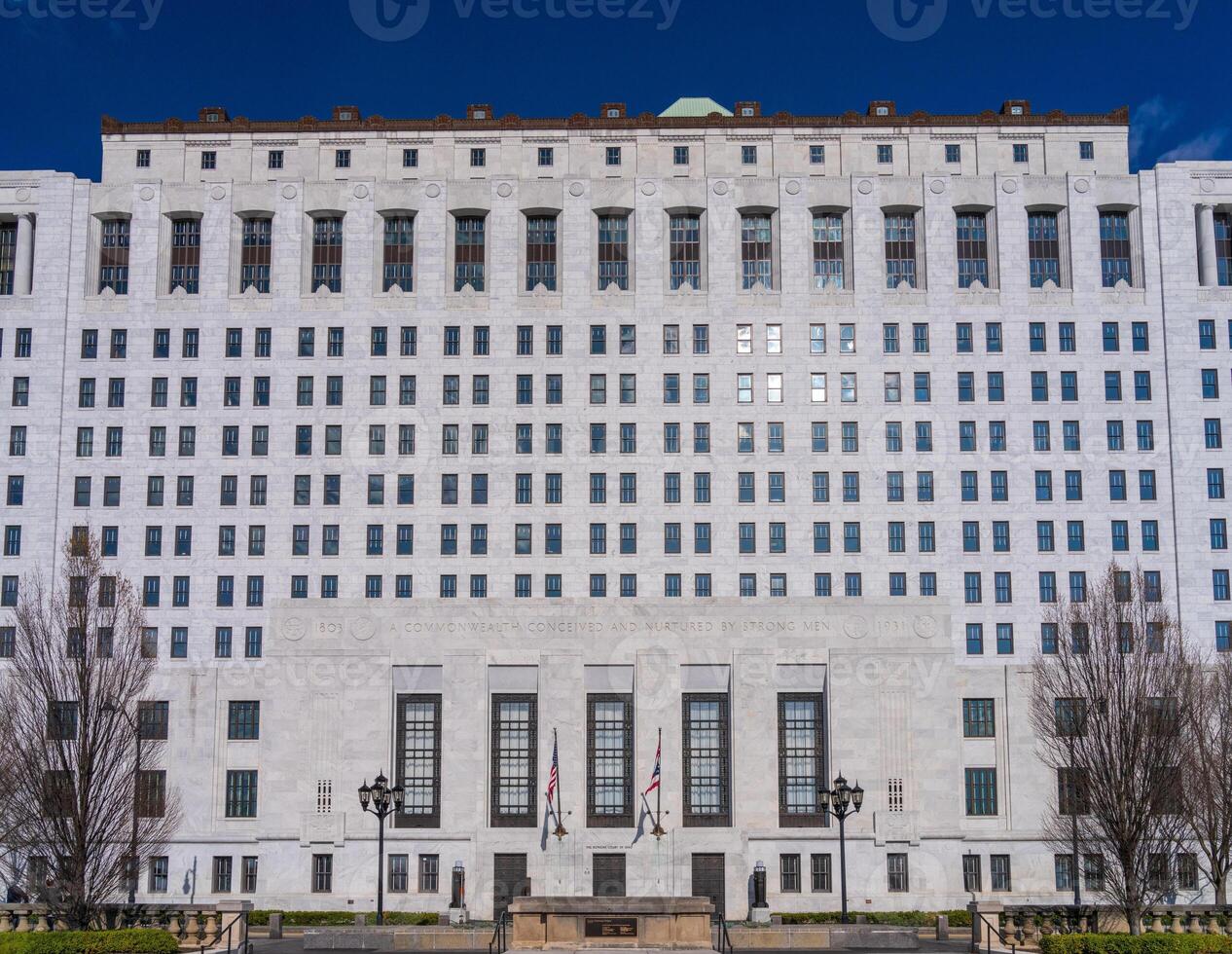 White marble entrance and facade to the Supreme Court of Ohio in Columbus with US flag flying photo