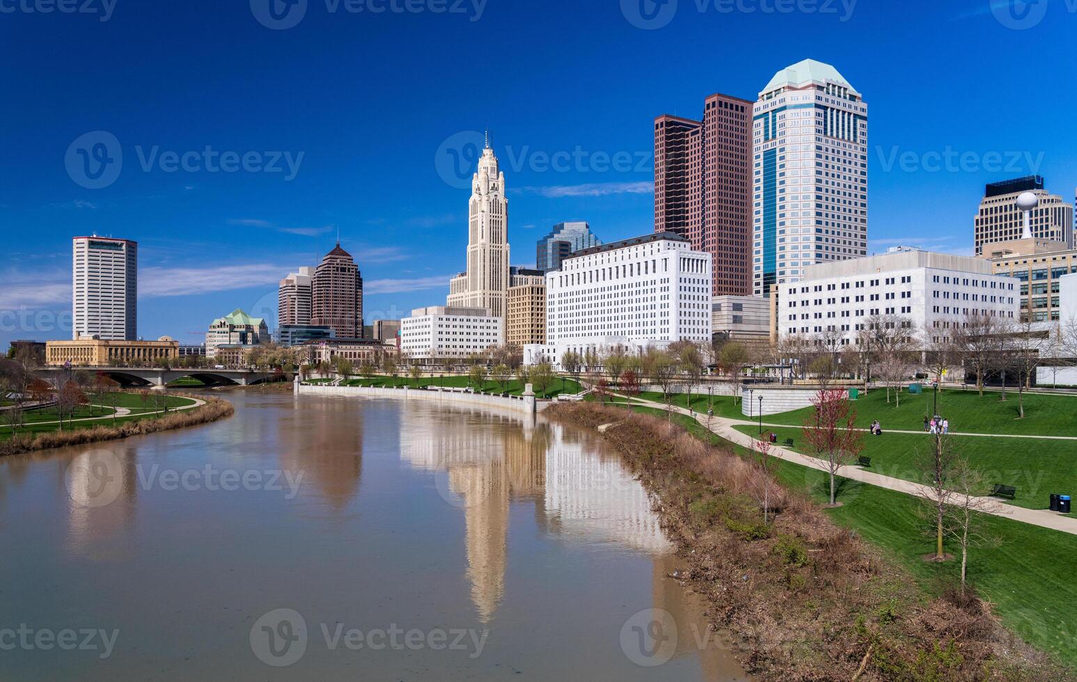 Columbus ohip waterfront view of the downtown financial district from the River Scioto after a flood over the park photo