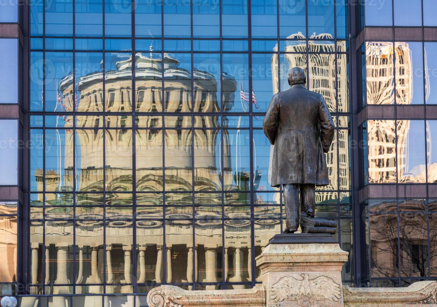 McKinley memorial in front of a reflection of the Ohio state Capitol building in the windows of an office building across the street in Columbus, OH photo