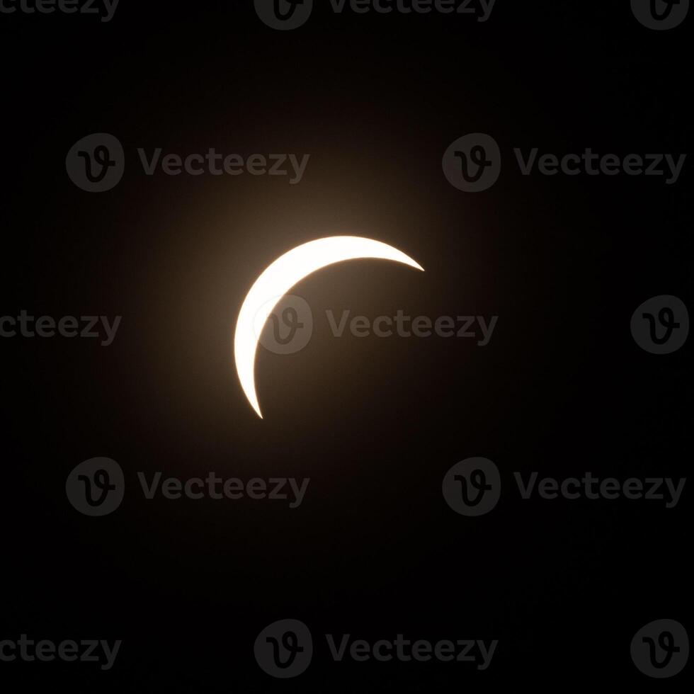 Final stage of the solar eclipse in April 2024 with the moon starting to cover the sun photo