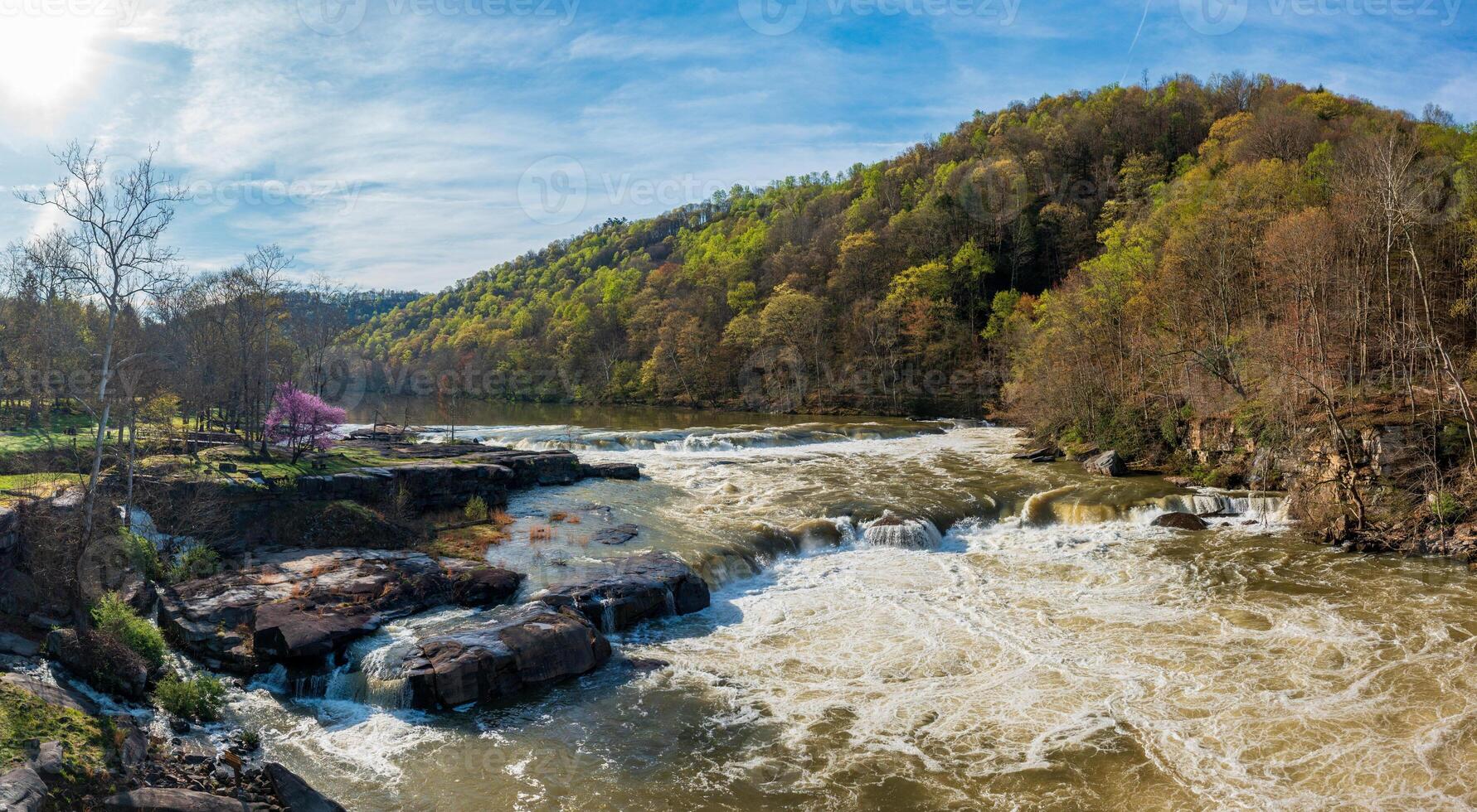 Aerial view of Valley Falls State Park near Fairmont in West Virginia on a spring day with redbud blossoms on the trees photo