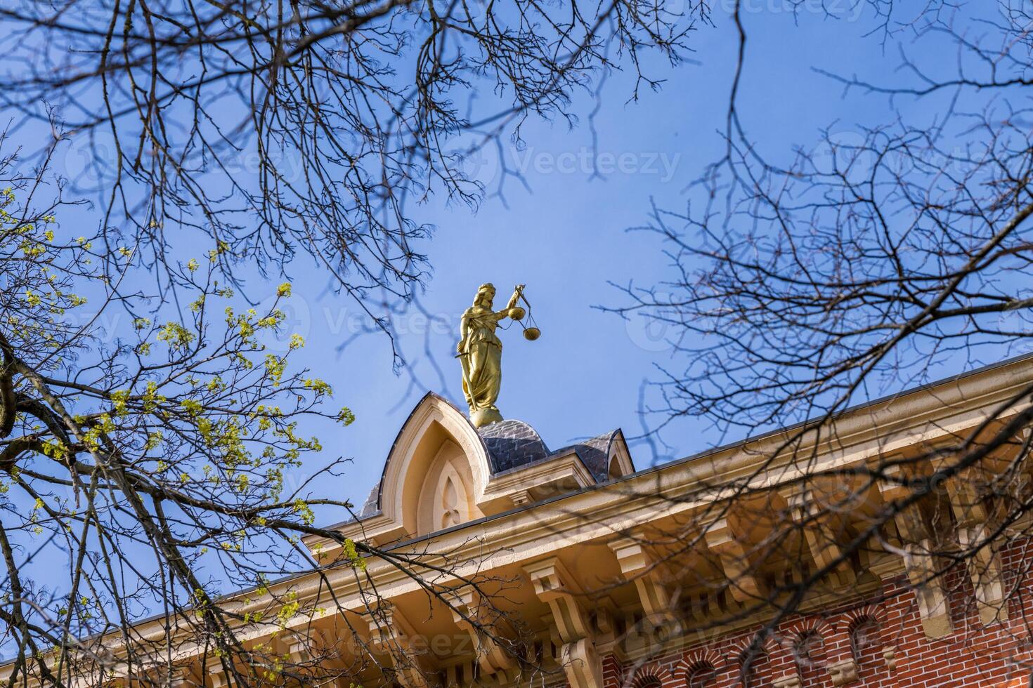 Lady Justice or Iustitia on the roof of the Delaware County Courthouse in Delaware, OH photo