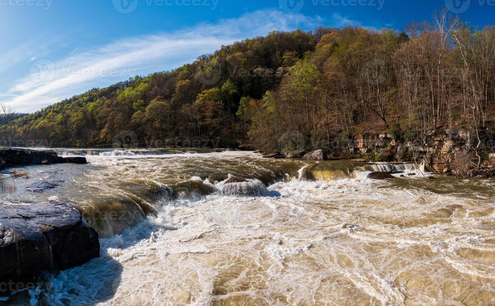 Aerial view of Valley Falls State Park near Fairmont in West Virginia on a spring day with redbud blossoms on the trees photo