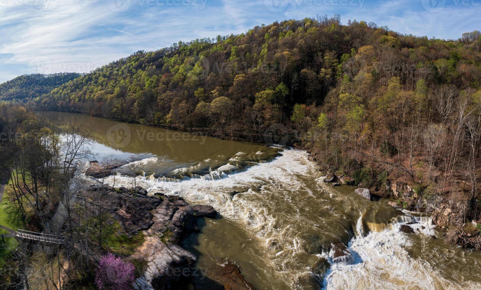 Aerial view of Valley Falls State Park near Fairmont in West Virginia on a spring day with redbud blossoms on the trees photo
