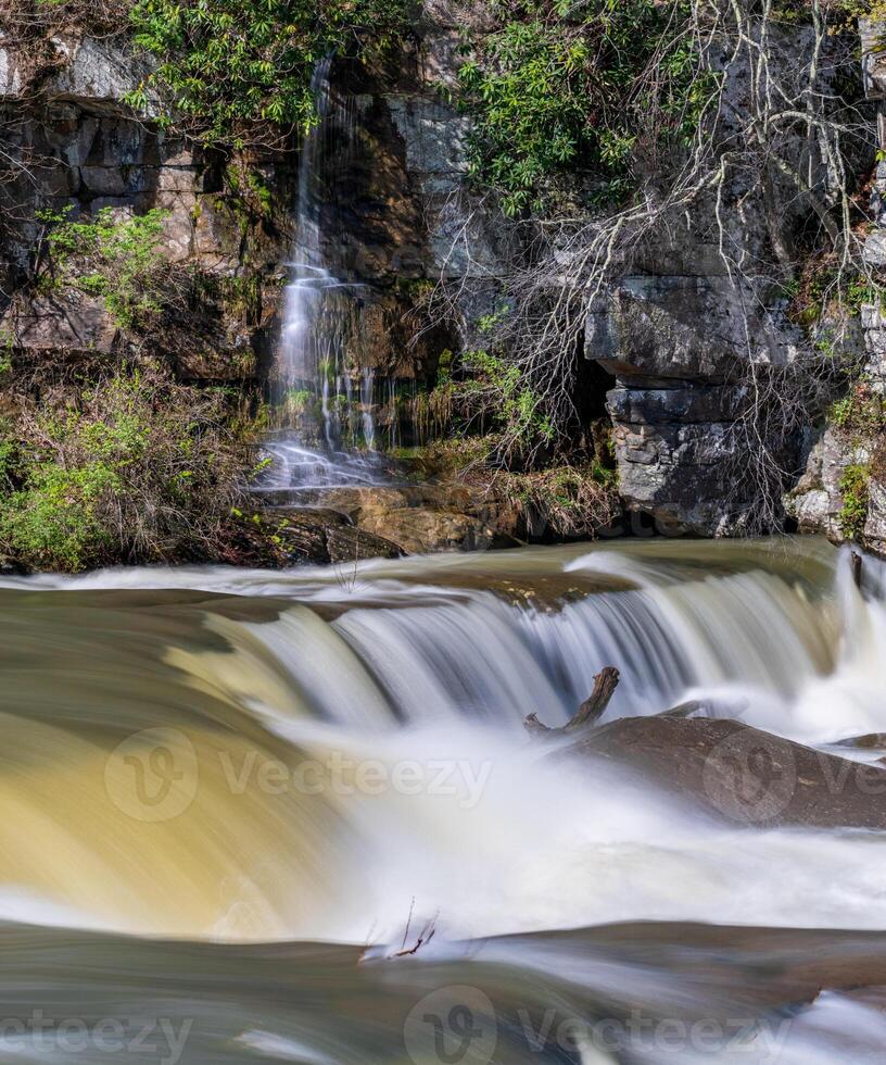 Small waterfall cascade on rocks by Valley Falls State Park near Fairmont in West Virginia on a colorful and bright spring day photo