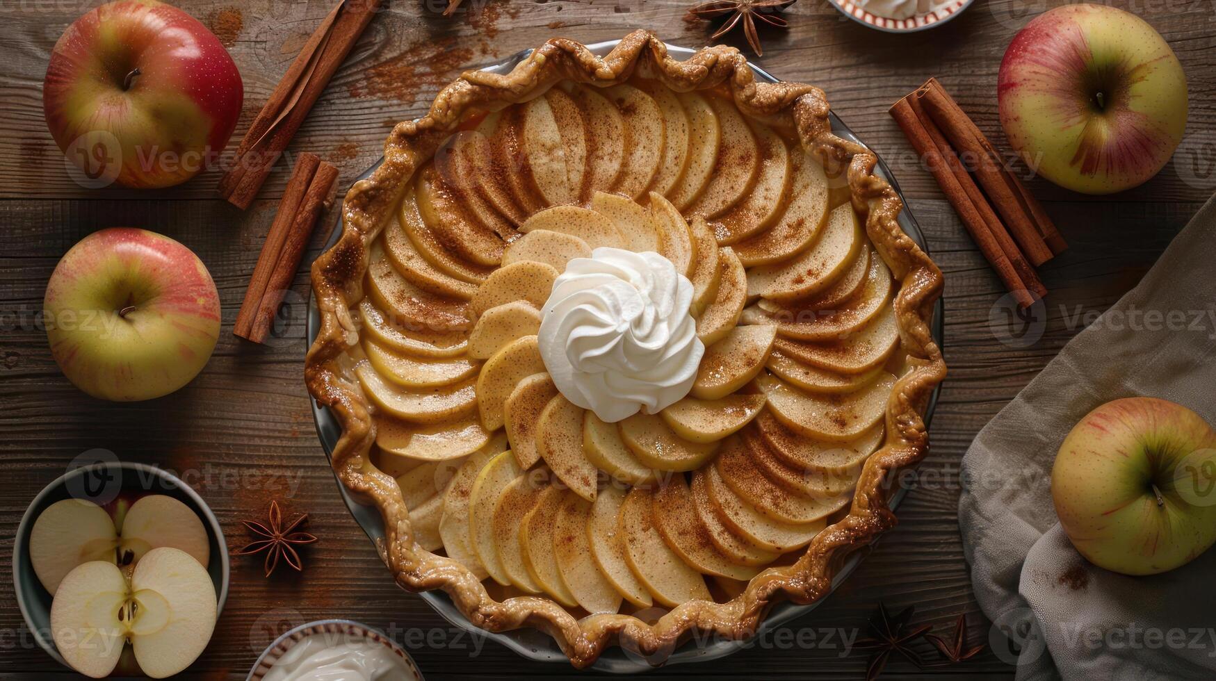 A fresh apple pie filled with sweet apples and cinnamon, topped with whipped cream. photo