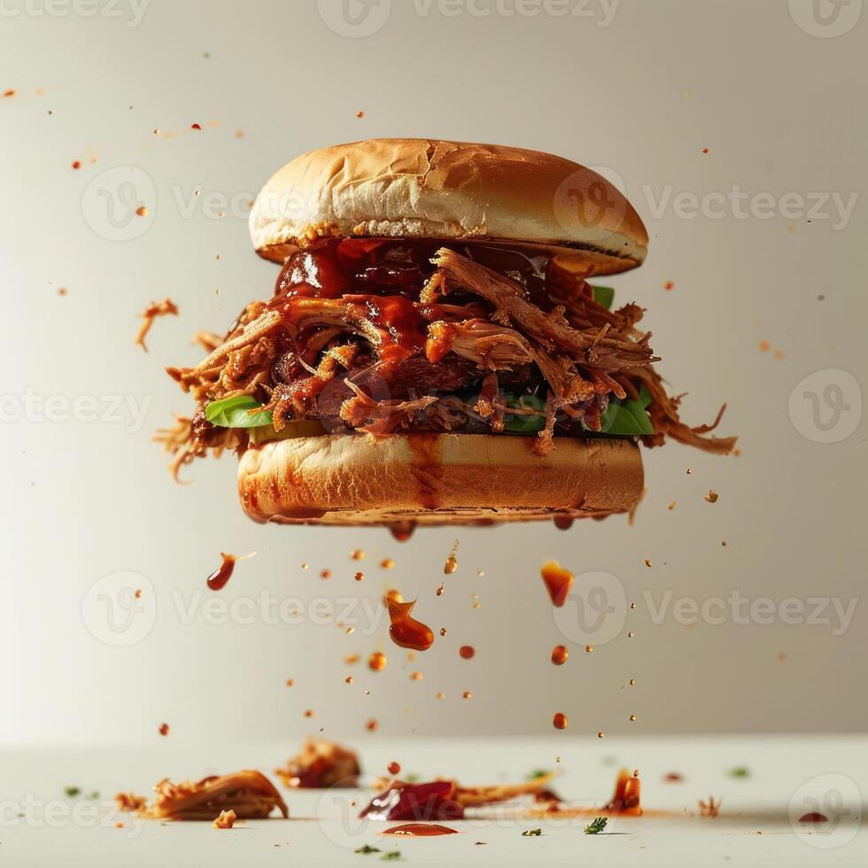 A close-up shot of a BBQ pulled pork sandwich with dripping barbecue sauce. photo