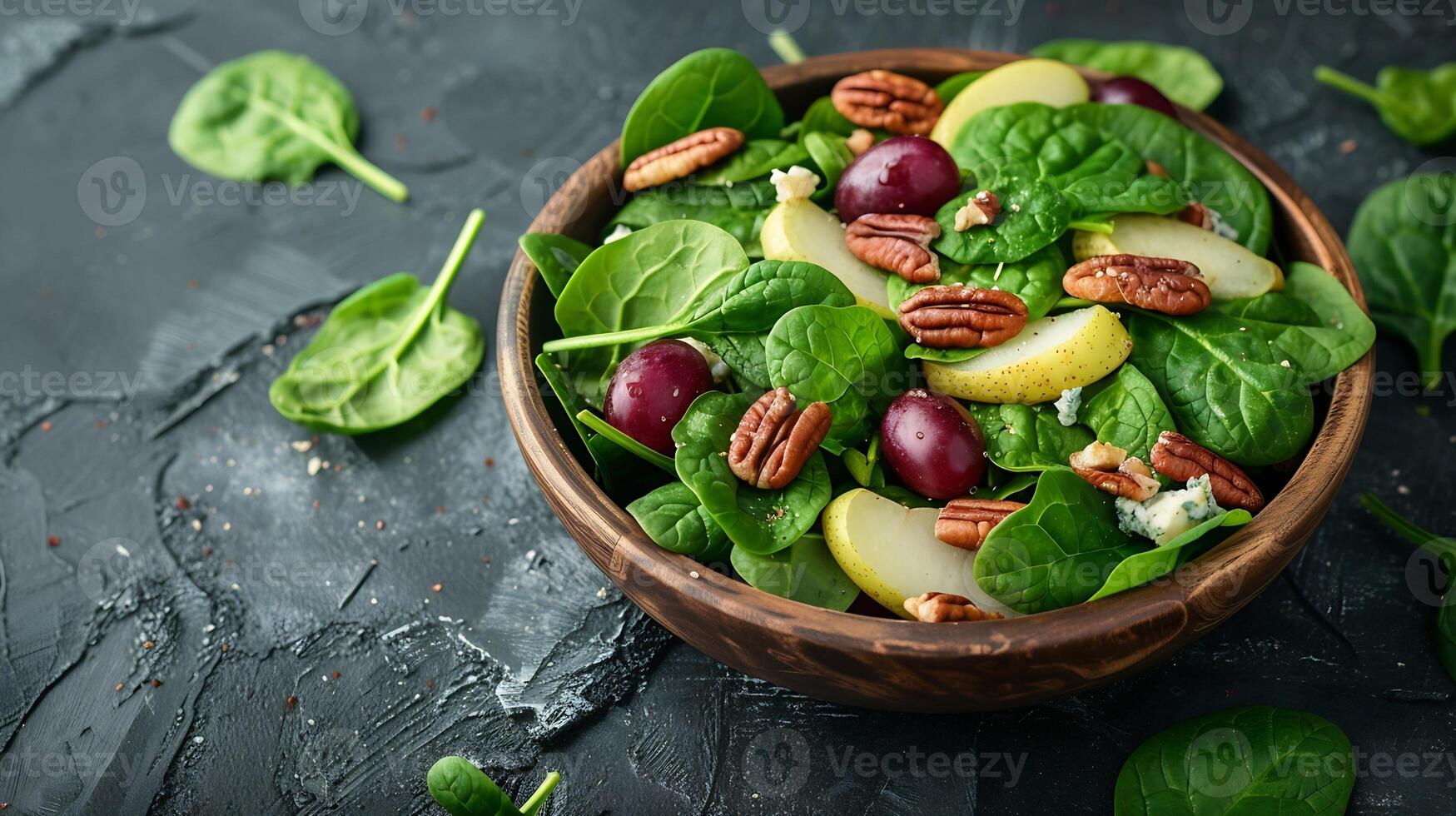 Salad of spinach pear grape pecan and gorgonzola cheese with lemon dressing Healthy food diet Top view photo
