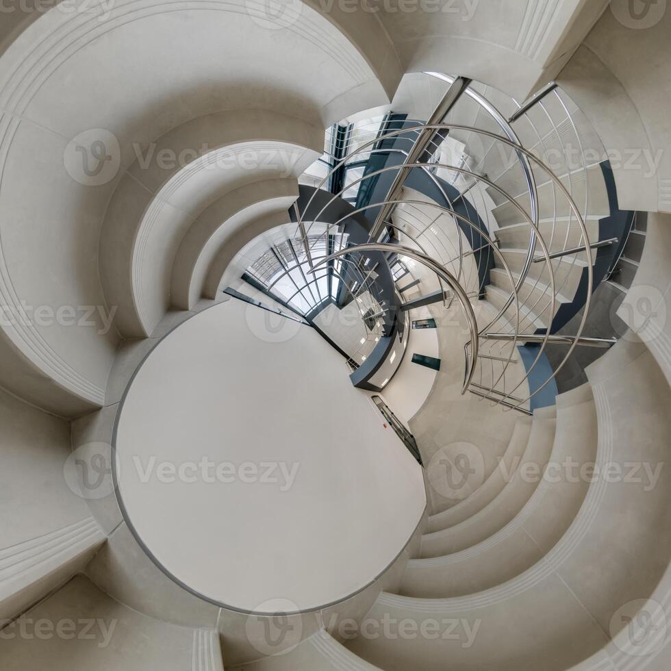abstractly twisted into spherical 360 panorama interior of modern office with hall staircase and panoramic windows photo