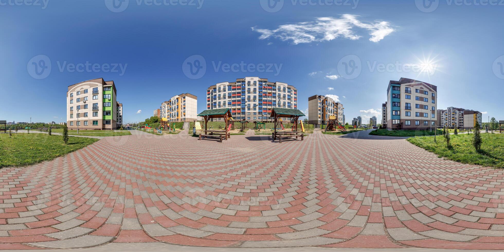 360 hdri panorama in middle of modern multi-storey multi-apartment residential complex of urban development in equirectangular seamless spherical projection, AR VR content photo
