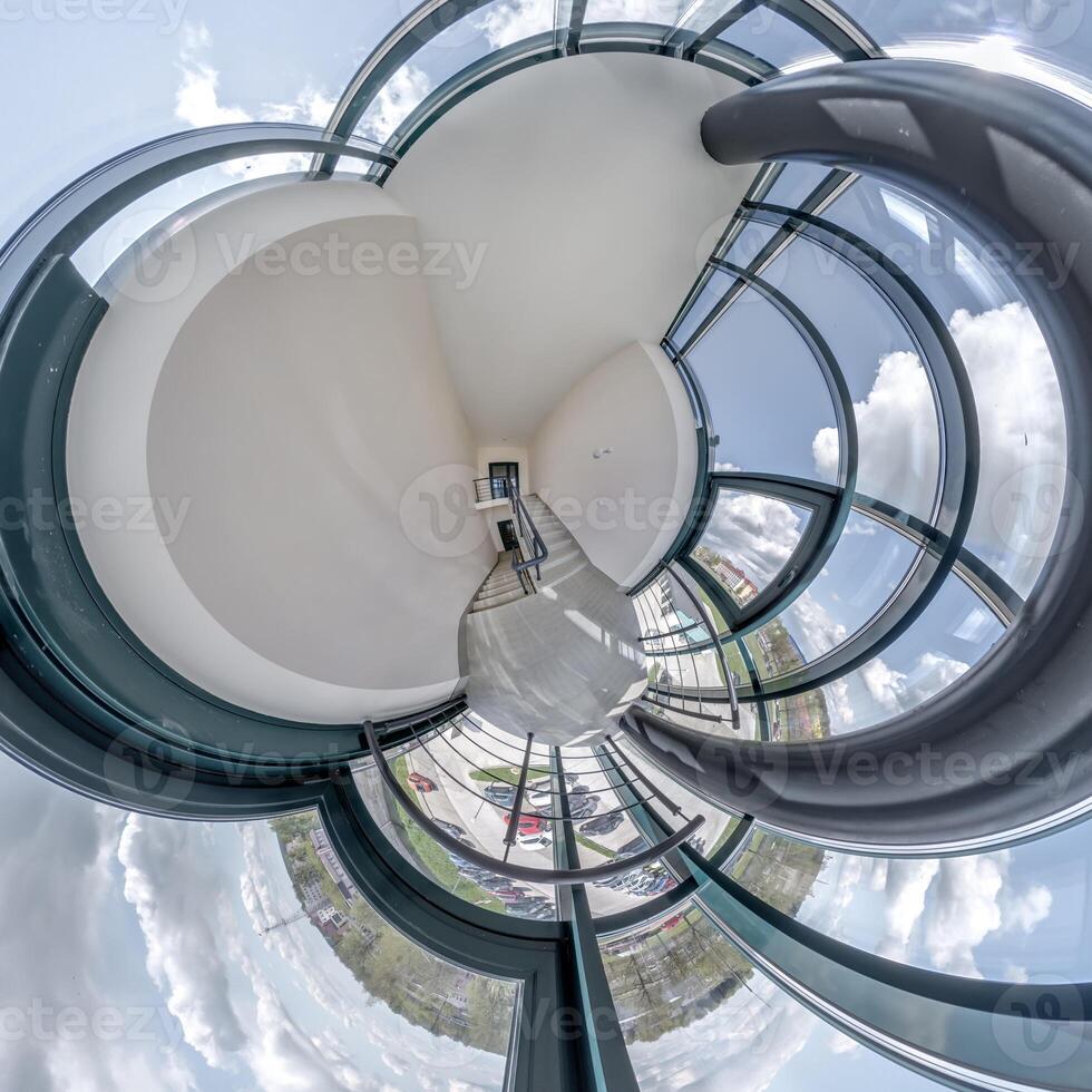 abstractly twisted into spherical 360 panorama interior of modern office with hall staircase and panoramic windows photo