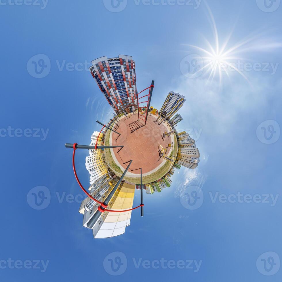 abstract swirling tiny planet spherical panorama of multi-storey buildings of skyscrapers of a residential complex in the form of a butterfly, bugs, crabs in blue sky photo