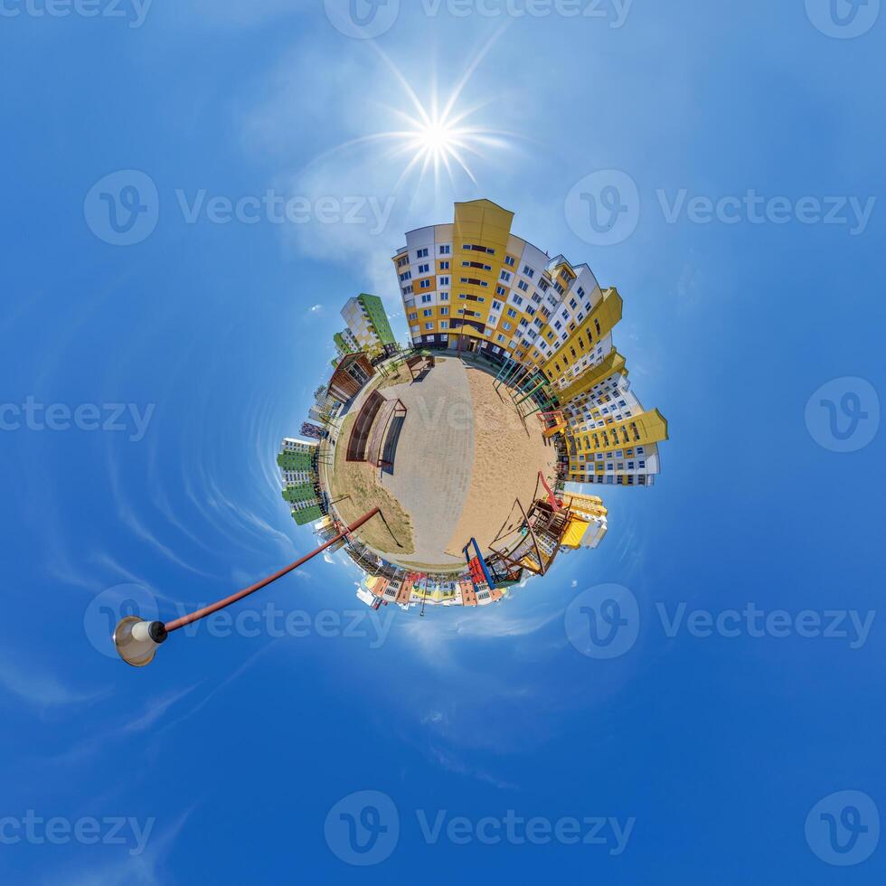 abstract swirling tiny planet spherical panorama of multi-storey buildings of skyscrapers of a residential complex in the form of a butterfly, bugs, crabs in blue sky photo