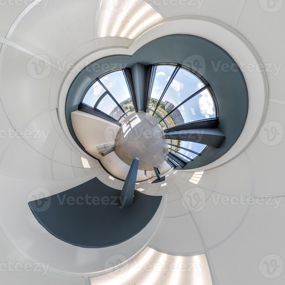 abstractly twisted into spherical 360 panorama interior of modern office with hall staircase and panoramic windows photo