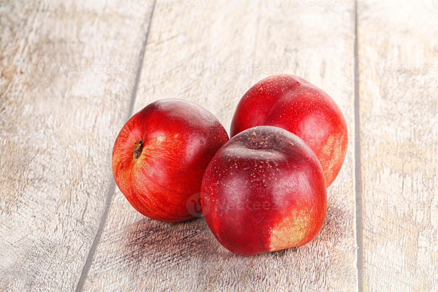 Ripe sweet juicy nectarines heap photo