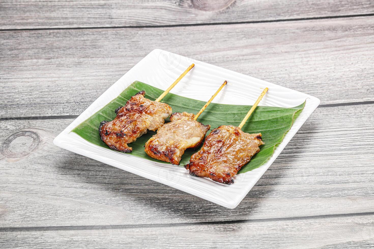 Thai cuisine - grilled pork skewer photo