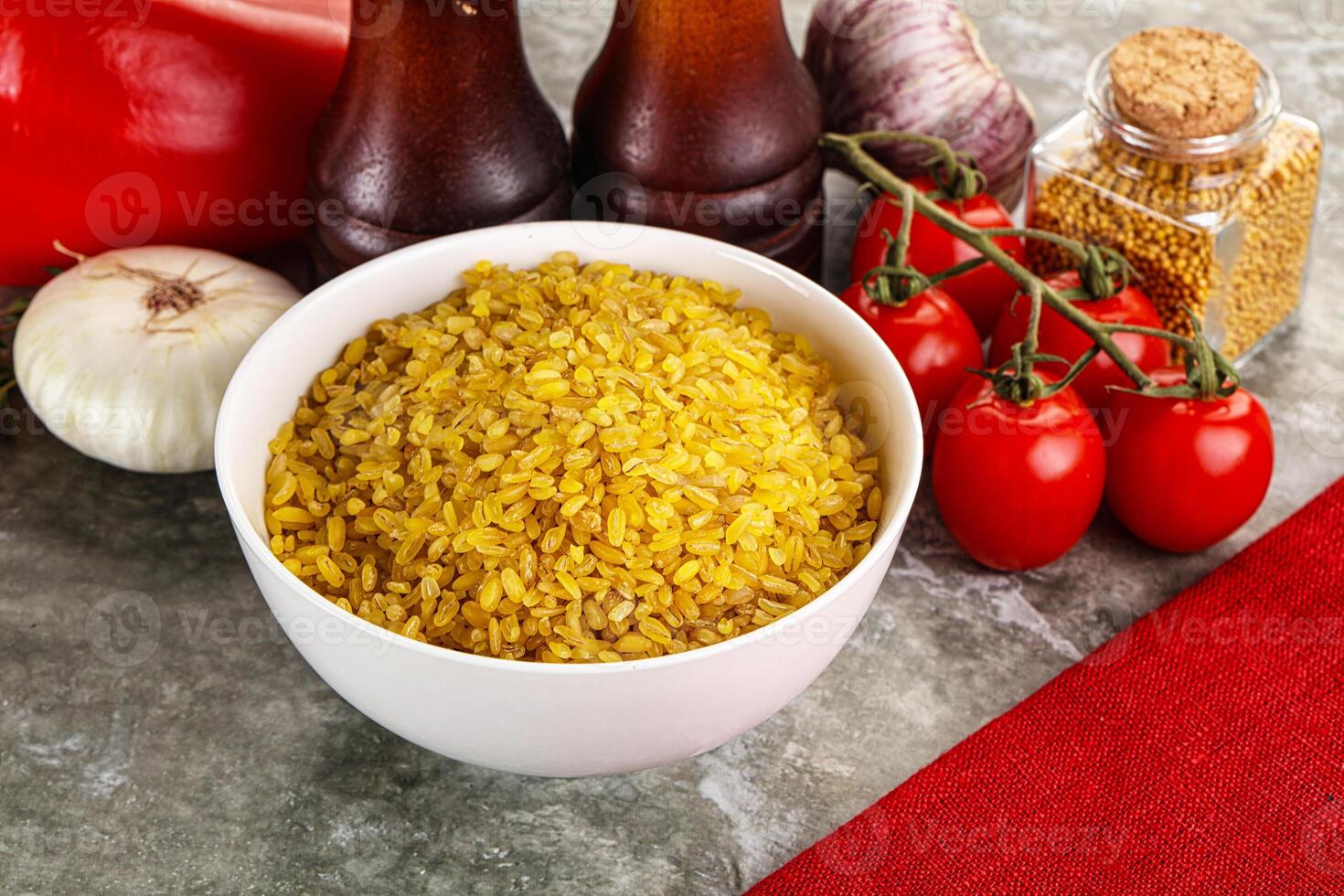 Dry wheat bulgur cereal heap photo