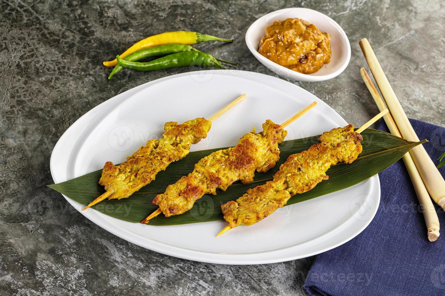Thai meat skewer Satay with sauce photo