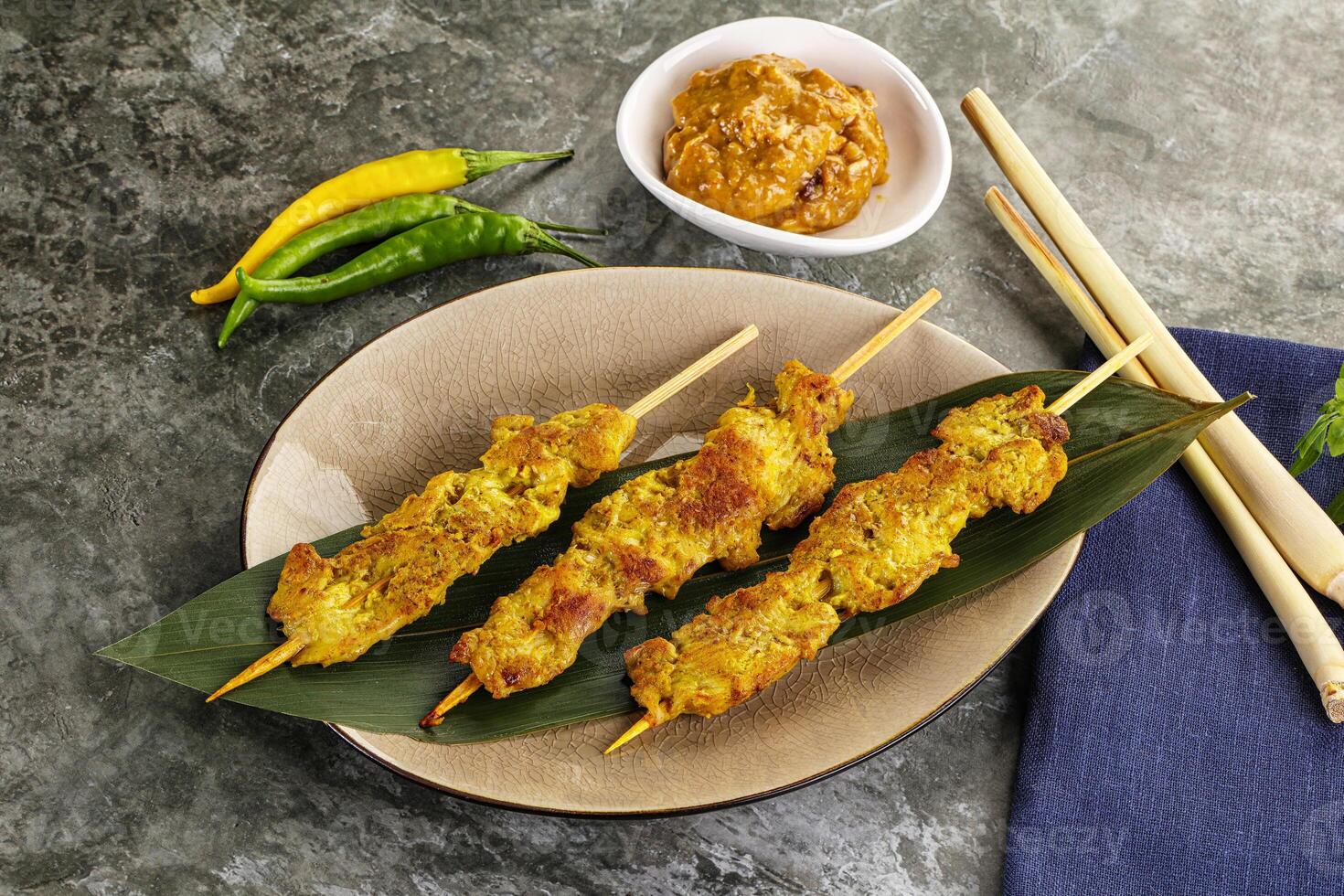 Thai meat skewer Satay with sauce photo