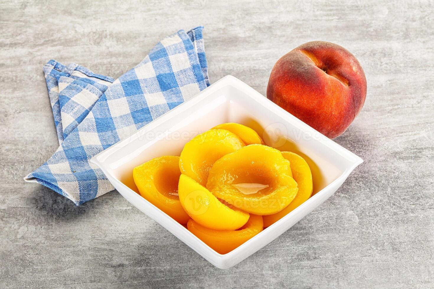 Ripe sweet and juicy canned peach photo