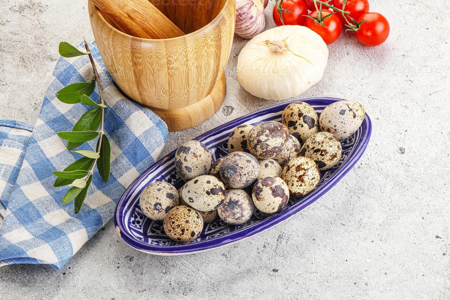 Raw quail eggs in the bowl photo