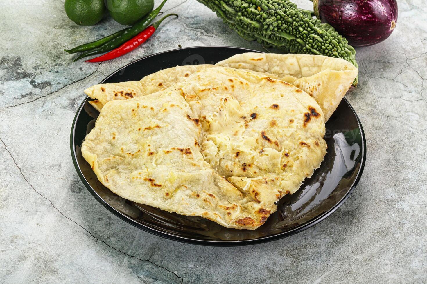 Indian tandori bread - naan with cheese photo