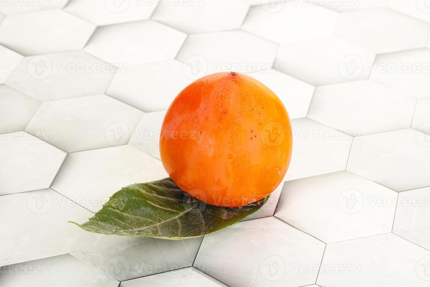 Fresh ripe sweet juicy persimmon photo