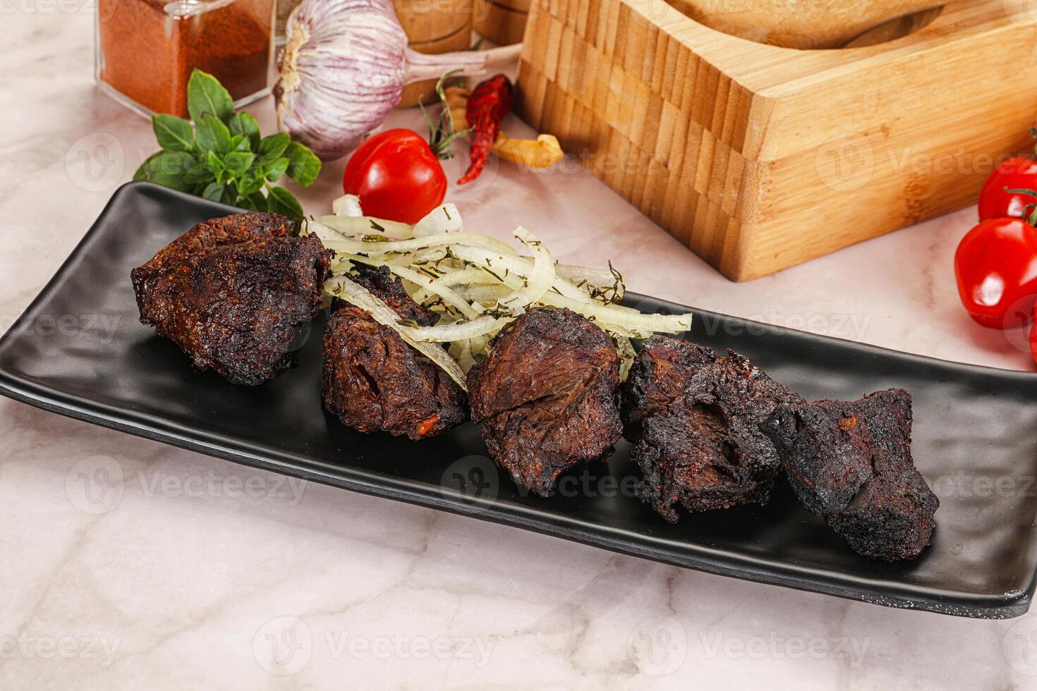 Grilled beef barbecue served onion photo