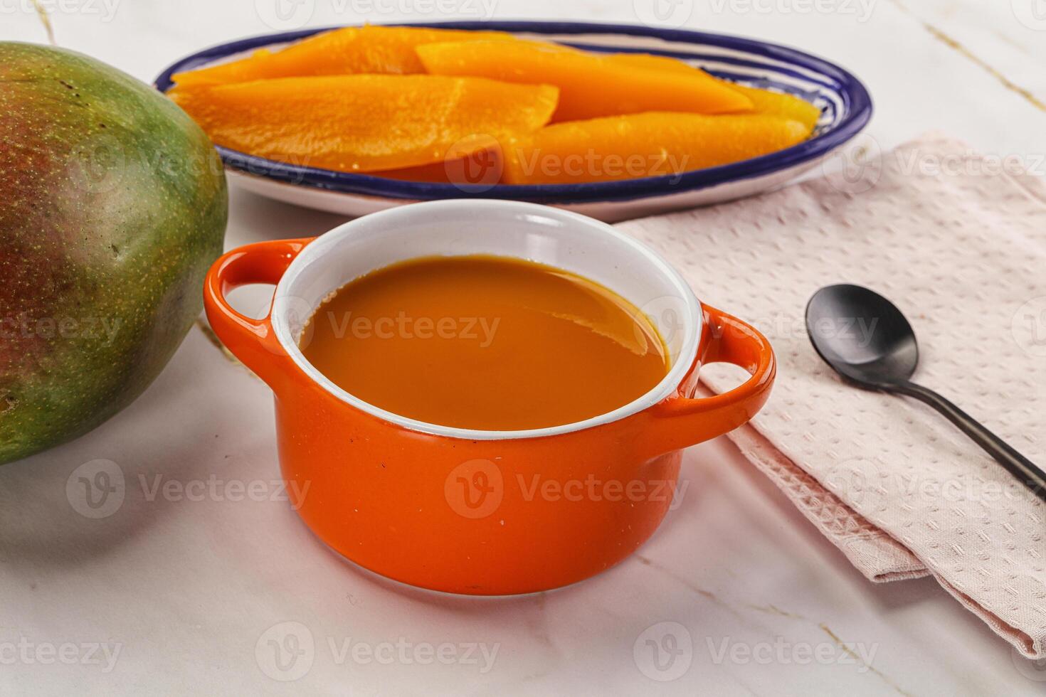 Sweet mango puree in the bowl photo