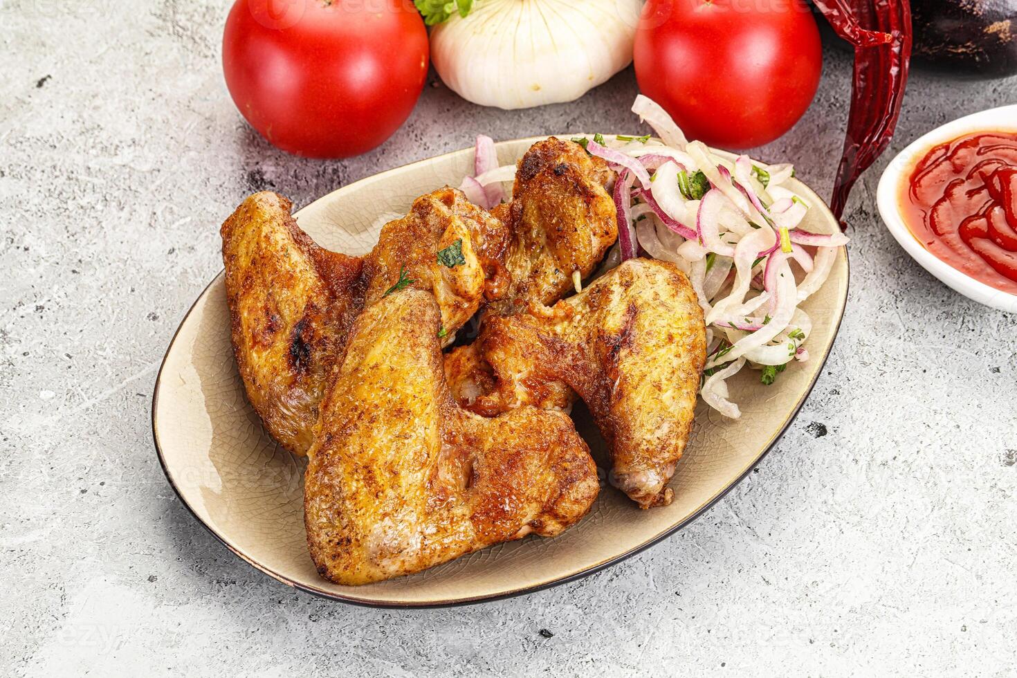 Grilled chicken wings with sauce photo