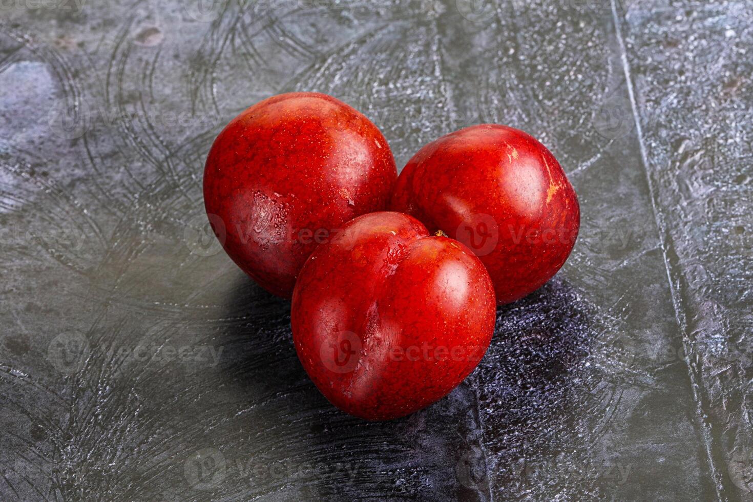 Ripe sweet juicy red plum photo