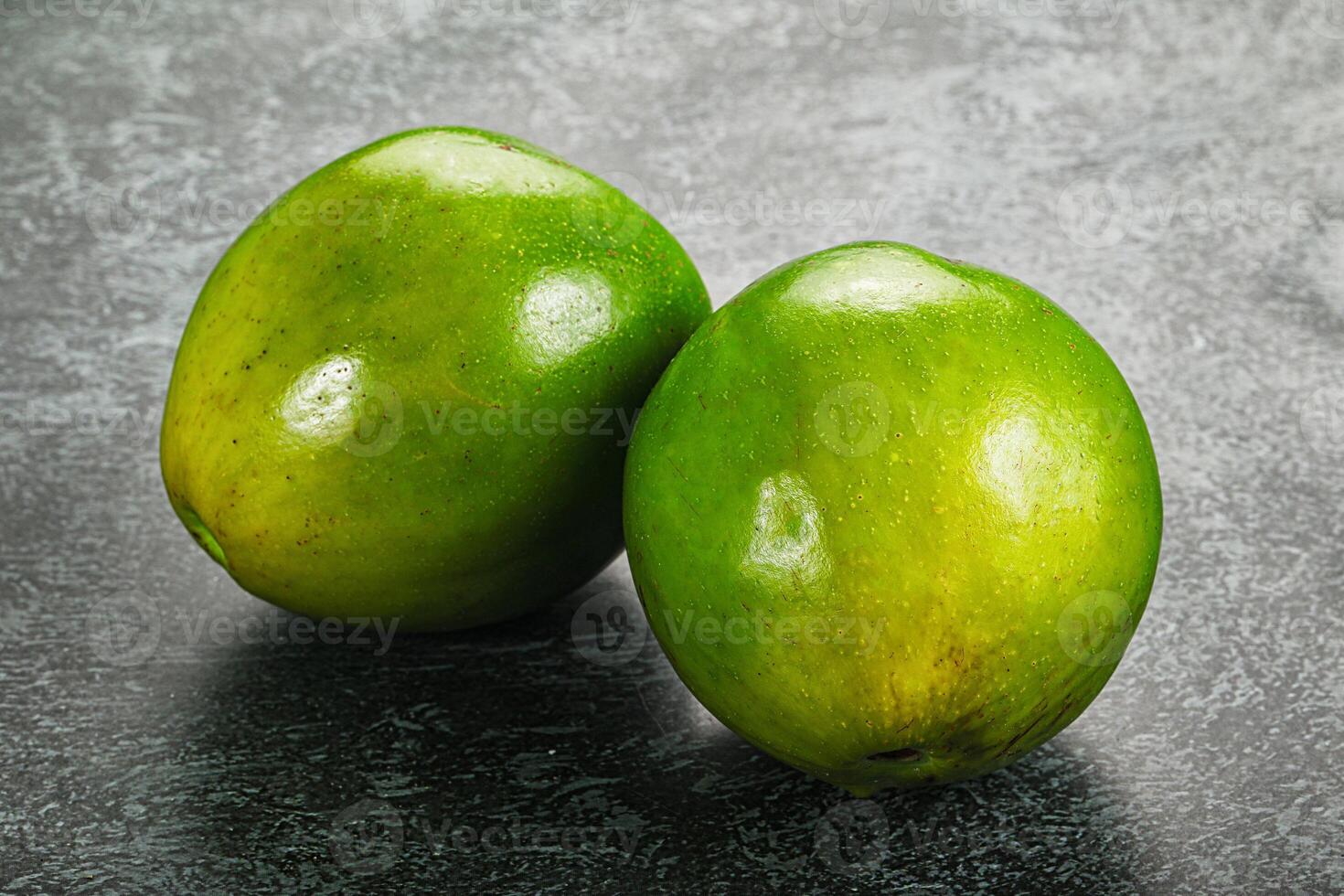 Two ripe green exotic avocado fruit photo