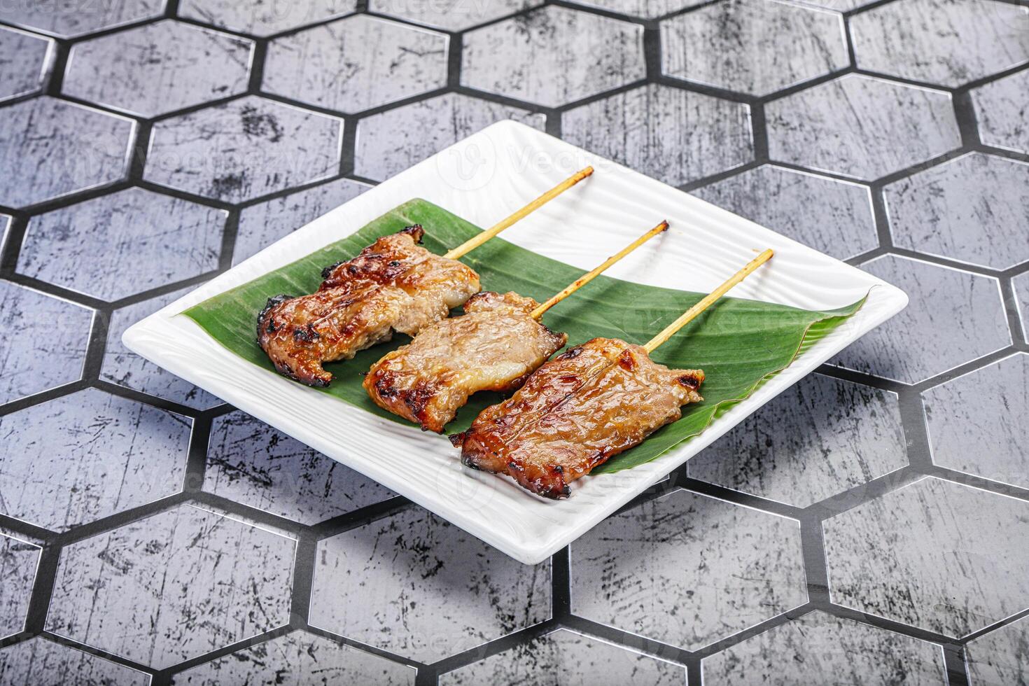 Thai cuisine - grilled pork skewer photo