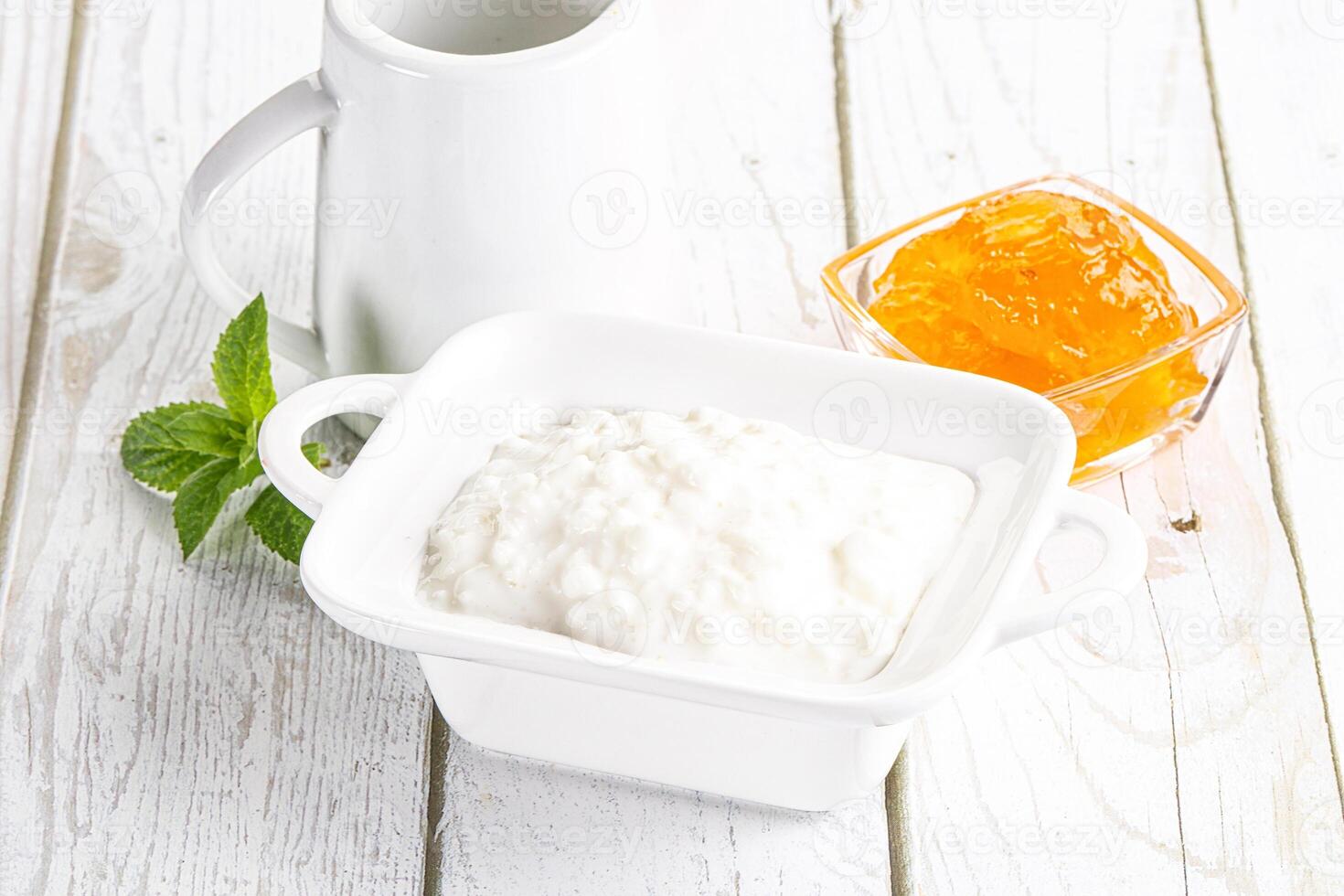 Grain curd with cream and jam photo