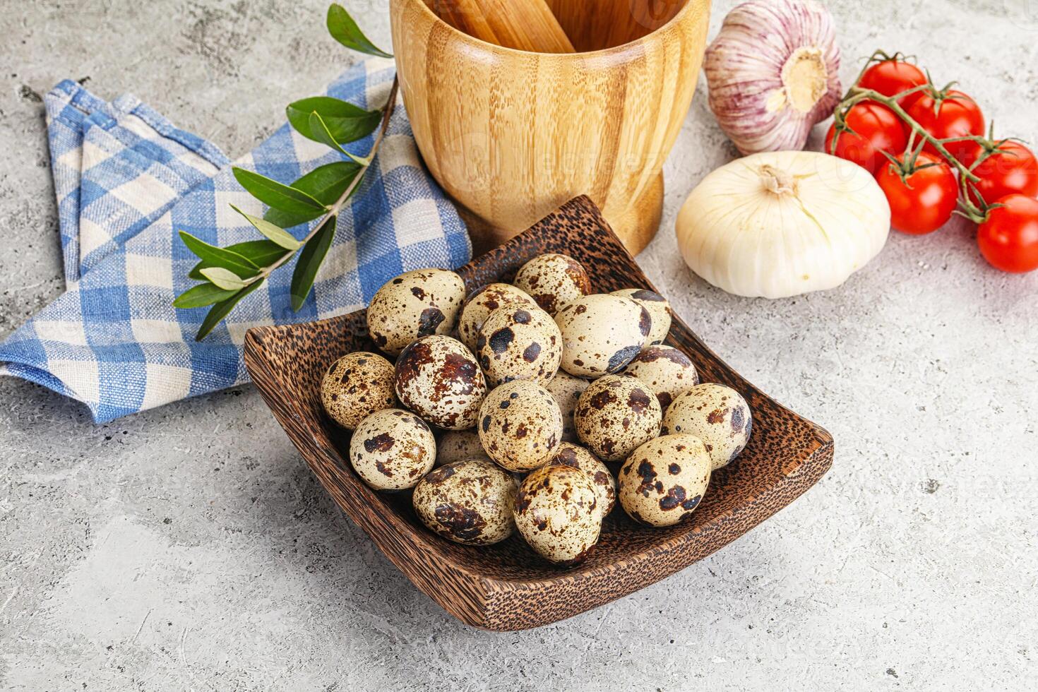 Raw quail eggs in the bowl photo